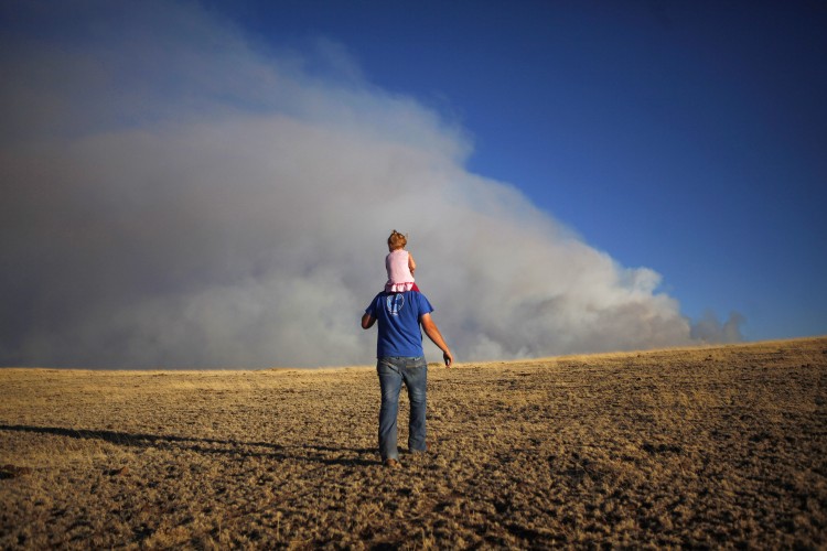 In this photo, a father holds his daughter to walk up a hill Springerville, Arizona. Father's Day gifts and cards have grown popular over the years. (Eric Thayer/Getty Images) In this photo, a father holds his daughter to walk up a hill Springerville, Arizona. Father's Day gifts and cards have grown popular over the years. (Eric Thayer/Getty Images)