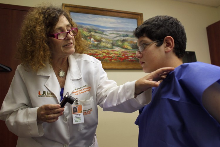 Doctor Antonella Tosti, Dermatologist University of Miami School of Medicine, examines Michael Casa Nova,12, for symptoms of skin cancer due to sun exposure on June 15, 2011 in Miami. (Joe Raedle/Getty Images) Doctor Antonella Tosti, Dermatologist University of Miami School of Medicine, examines Michael Casa Nova,12, for symptoms of skin cancer due to sun exposure on June 15, 2011 in Miami. (Joe Raedle/Getty Images)
