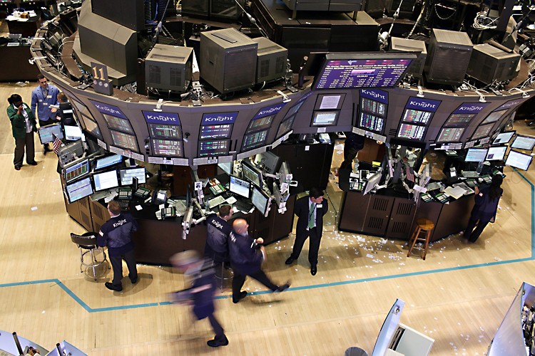MARKETS SOARING: Traders work on the floor of the New York Stock Exchange on June 23 in this file photo. (Spencer Platt/Getty Images)