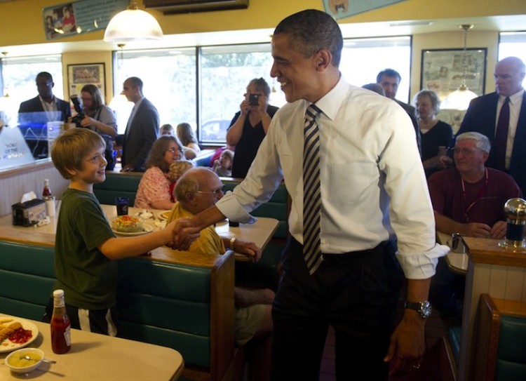 US President Barack Obama greets patrons while stopping for lunch at Ross' Restaurant in Bettendorf, Iowa, June 28.  (Saul Loeb/AFP/Getty Images)