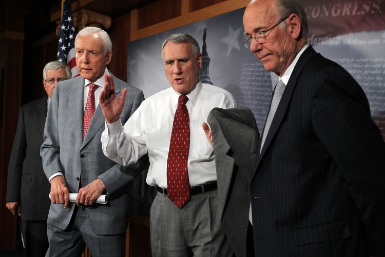 Sen. Mike Enzi (R-Wyo.), Sen. Orrin Hatch (R-Utah), Senate Minority Whip Sen. Jon Kyl (R-Ariz.), and Sen. Pat Roberts (R-Kan.) attend a news conference June 30 on Capitol Hill.