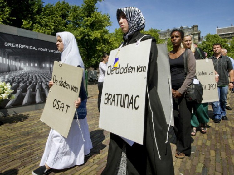 People gather to commemorate the 16th anniversary of the Srebrenica massacre in the Hague, on July 11. (Marcel Antonisse/AFP/Getty Images) People gather to commemorate the 16th anniversary of the Srebrenica massacre in the Hague, on July 11. (Marcel Antonisse/AFP/Getty Images)