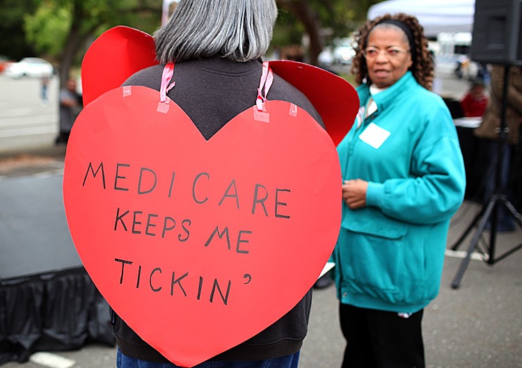 ENTITLEMENTS: A senior citizen holds a sign during a rally to protect federal health programs at the 8th Annual Healthy Living Festival in Oakland, Calif., July 15. (Justin Sullivan/Getty Images) ENTITLEMENTS: A senior citizen holds a sign during a rally to protect federal health programs at the 8th Annual Healthy Living Festival in Oakland, Calif., July 15. (Justin Sullivan/Getty Images)