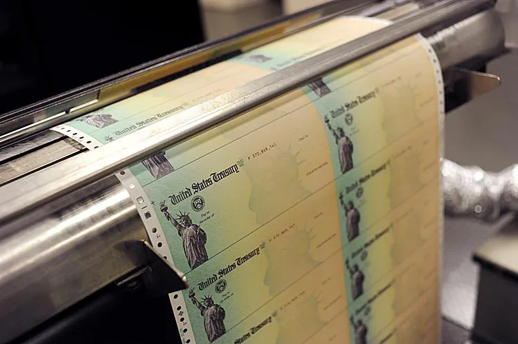 Blank U.S. Treasury checks run through a printer at the U.S. Treasury facility in Philadelphia, Pa.  (William Thomas Cain/Getty Images)