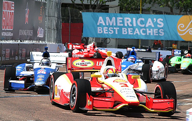11AStPeteActionStPete12 Helio Castroneves speeds through the streets of St. Petersburg. IndyCar will be bringing its intense street-racing action to Houston starting in 2013. (James Fish/The Epoch Times)
