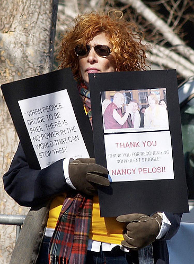 Diane Gatterdam, a New York City interior designer, protested for Tibet at Tiananmen Square during the Beijing Olympic Games. Photo taken March 10 in front of the United Nations building in New York. (Courtesy Diane Gatterdam) Diane Gatterdam, a New York City interior designer, protested for Tibet at Tiananmen Square during the Beijing Olympic Games. Photo taken March 10 in front of the United Nations building in New York. (Courtesy Diane Gatterdam)