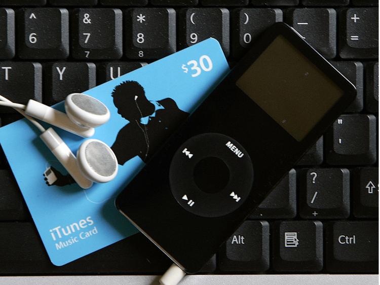 CD NO MORE: Buy tunes with your ITunes music card download to your computer, and listen with your iPod Nano. No packaging, no shipping, no waste. (Robert Sullivan/AFP/Getty Images) CD NO MORE: Buy tunes with your ITunes music card download to your computer, and listen with your iPod Nano. No packaging, no shipping, no waste. (Robert Sullivan/AFP/Getty Images)