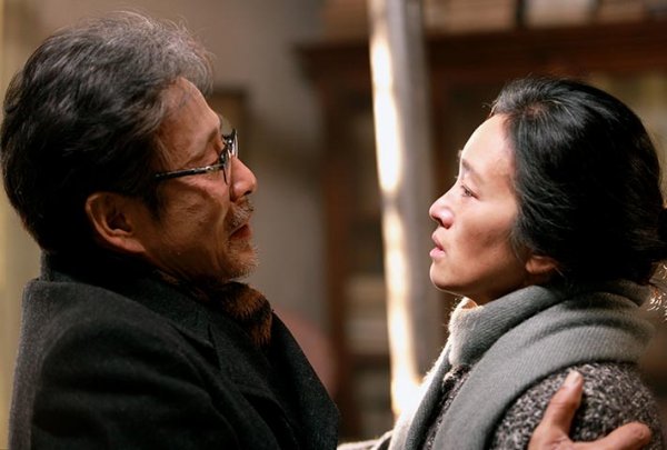 Chen Daoming as Lu and Gong Li as Feng in