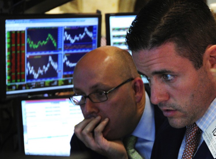 WORRIED LOOK: Traders react to the market downfall on the floor of the New York Stock Exchange at the closing bell Aug. 10. U.S. stocks plummeted over 4 percent Wednesday, more than wiping out the gains of Tuesday's rebound. (Stand Honda/Getty Images) WORRIED LOOK: Traders react to the market downfall on the floor of the New York Stock Exchange at the closing bell Aug. 10. U.S. stocks plummeted over 4 percent Wednesday, more than wiping out the gains of Tuesday's rebound. (Stand Honda/Getty Images)