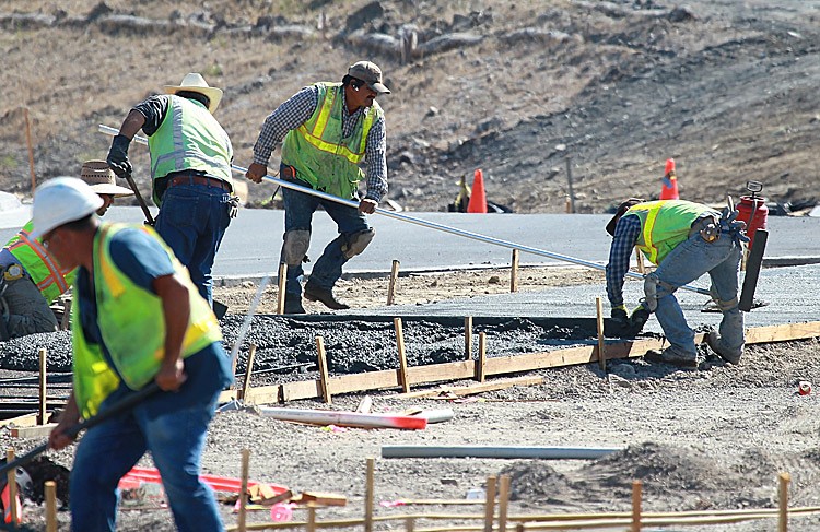 Construction workers smooth concrete for a walkway at a new housing development on Aug. 16 in Petaluma, Calif. The World Economic Forum's annual global competitiveness report showed that the United States fell one place to fifth in the world in business competitiveness. (Justin Sullivan/Getty Images) Construction workers smooth concrete for a walkway at a new housing development on Aug. 16 in Petaluma, Calif. The World Economic Forum's annual global competitiveness report showed that the United States fell one place to fifth in the world in business competitiveness. (Justin Sullivan/Getty Images)