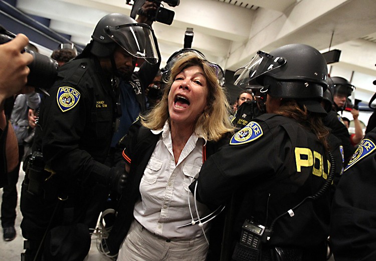 SAN FRANCISCO, CA - AUGUST 22: Bay Area Rapid Transit (BART) police arrest a demonstrator during a protest on the platform at the Civic Center station. SAN FRANCISCO, CA - AUGUST 22: Bay Area Rapid Transit (BART) police arrest a demonstrator during a protest on the platform at the Civic Center station.