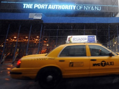 A taxi passes by the Port Authority in New York City. (TIMOTHY A. CLARY/AFP/Getty Images)