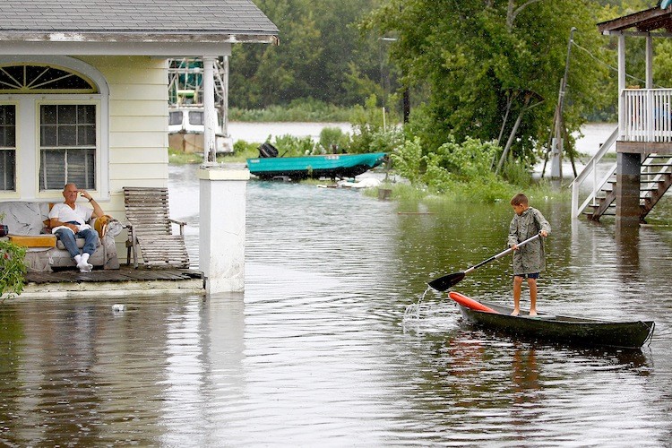FLOODED IN LOUISIANA: A boy paddles his canoe through flood waters on September 4 in Lafitte, Louisiana. In Louisiana, Texas, and Mississippi, Lee's rains caused flooding. (Sean Gardner/Getty Images) FLOODED IN LOUISIANA: A boy paddles his canoe through flood waters on September 4 in Lafitte, Louisiana. In Louisiana, Texas, and Mississippi, Lee's rains caused flooding. (Sean Gardner/Getty Images)