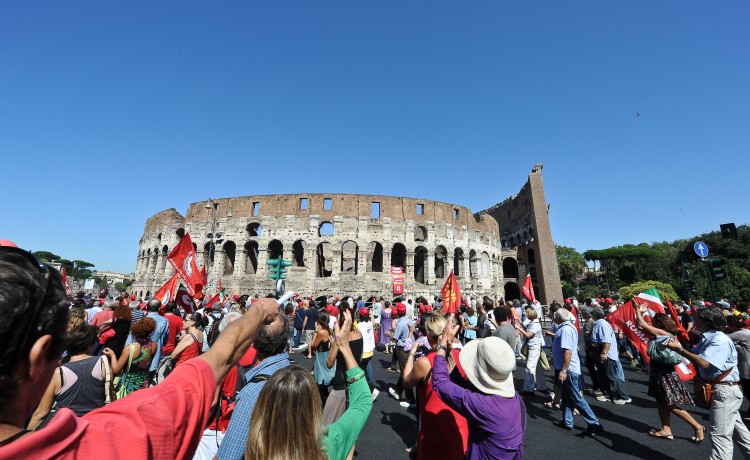 Workers march in front of the ancient Colosseum as they take part in a demonstration organized by CGIL against the government's economic austerity measures, in central Rome, on September 6. (Andreas Solar/AFP/Getty Images) Workers march in front of the ancient Colosseum as they take part in a demonstration organized by CGIL against the government's economic austerity measures, in central Rome, on September 6. (Andreas Solar/AFP/Getty Images)