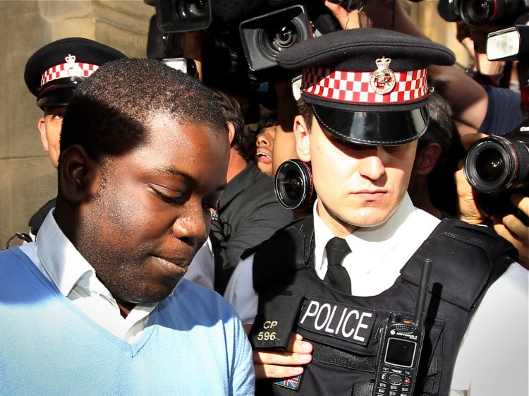 UBS trader Kweku Adoboli (L) is led into a prison van as he leaves City of London Magistrates Court in London, on Sept. 16. Adoboli allegedly engaged in unauthorized trades, losing the bank in excess of $2.3 billion. (Adrian Dennis/AFP/Getty Images) UBS trader Kweku Adoboli (L) is led into a prison van as he leaves City of London Magistrates Court in London, on Sept. 16. Adoboli allegedly engaged in unauthorized trades, losing the bank in excess of $2.3 billion. (Adrian Dennis/AFP/Getty Images)