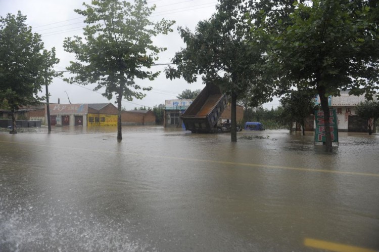 A flooded schoolyard is seen on Sept. 18 in Zhouzhi County, Shaanxi Province of China. (ChinaFotoPress/Getty Images) A flooded schoolyard is seen on Sept. 18 in Zhouzhi County, Shaanxi Province of China. (ChinaFotoPress/Getty Images)
