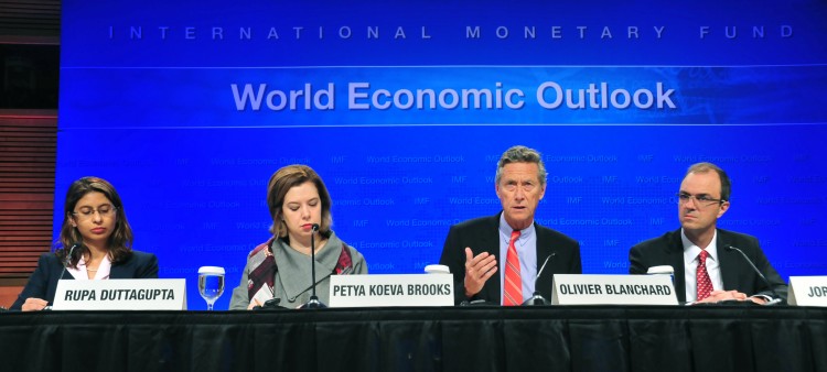 Olivier Blanchard(2nd-R), chief economist for the IMF speaks Sept. 20 at IMF headquarters in Washington, D.C. According to Blanchard the global economy has entered a dangerous new phase. The recovery has weakened considerably, and downside risks have incr (Karen Bleier/AFP/Getty Images)