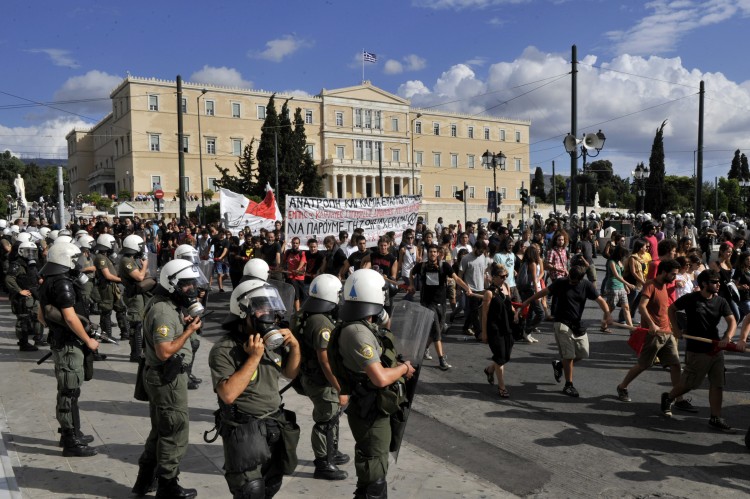 Police stand guard as students and teachers protest in front of the Greek parliament on September 22, 2011. (Louisa Gouliamaki/AFP/Getty Images) Police stand guard as students and teachers protest in front of the Greek parliament on September 22, 2011. (Louisa Gouliamaki/AFP/Getty Images)
