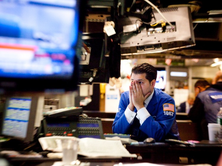 A trader reacts on the floor of the New York Stock Exchange, Sept. 22. The Dow plunged as much as 500 points at one point on the grim global economic outlook. (Michael Nagle/Getty Images) A trader reacts on the floor of the New York Stock Exchange, Sept. 22. The Dow plunged as much as 500 points at one point on the grim global economic outlook. (Michael Nagle/Getty Images)