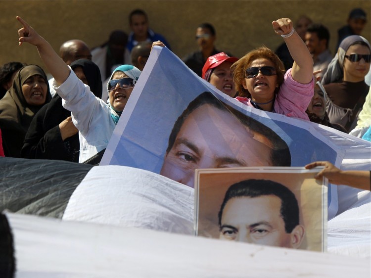 Supporters of Egypt's ousted president Hosni Mubarak (portraits) protest outside the police academy in Cairo where his trial resumed on Sept. 24, 2011. (Khaled Desouki/AFP/Getty Images) Supporters of Egypt's ousted president Hosni Mubarak (portraits) protest outside the police academy in Cairo where his trial resumed on Sept. 24, 2011. (Khaled Desouki/AFP/Getty Images)