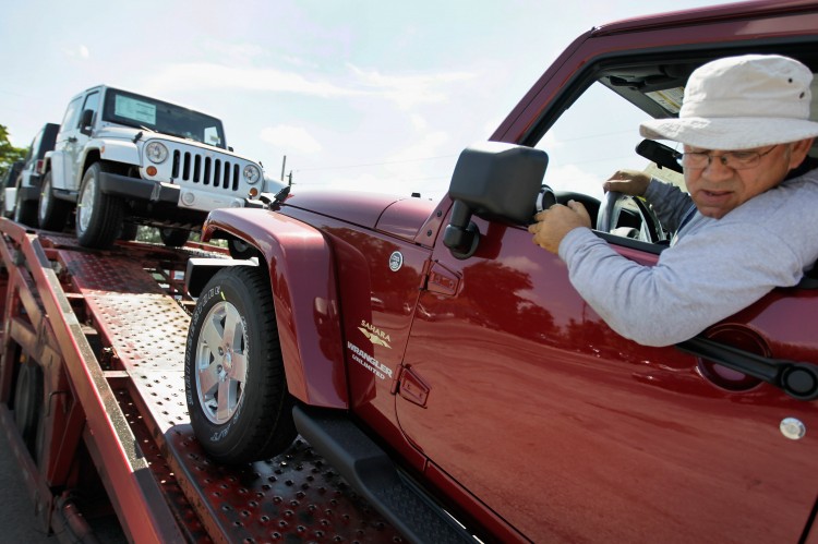 Jose Ortega drives a new Jeep vehicle off a truck as he delivers the new vehicles to the Hollywood Chrysler Jeep sales lot on Oct. 3 in Hollywood, Fla. Chrysler Group LLC reported that its U.S. sales last month was a 27 percent increase compared with 2010 September sales. (Joe Raedle/Getty Images) Jose Ortega drives a new Jeep vehicle off a truck as he delivers the new vehicles to the Hollywood Chrysler Jeep sales lot on Oct. 3 in Hollywood, Fla. Chrysler Group LLC reported that its U.S. sales last month was a 27 percent increase compared with 2010 September sales. (Joe Raedle/Getty Images)