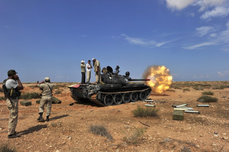 A National Transitional Council tank fires shells against troops loyal to Moammar Gadhafi in the town of Sirte on October 4, 2011. (Aris Messinis/AFP/Getty Images) A National Transitional Council tank fires shells against troops loyal to Moammar Gadhafi in the town of Sirte on October 4, 2011. (Aris Messinis/AFP/Getty Images)