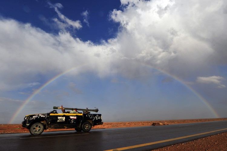 A National Transitional Council soldier drives his vehicle on the highway between Mistrata and the battle front town of Sirte on October 4, 2011. (Aris Messinis/AFP/Getty Images) A National Transitional Council soldier drives his vehicle on the highway between Mistrata and the battle front town of Sirte on October 4, 2011. (Aris Messinis/AFP/Getty Images)