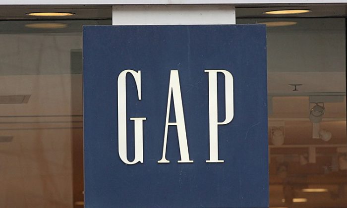 A sign hangs above the entrance of a Gap store in Chicago, Ill., Oct. 13. Gap Inc. plans to reduce the number of Gap brand stores to 700 in North America, closing roughly one-third of its existing stores by the end of 2013. (Scott Olson/Getty Images)