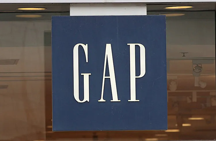 A sign hangs above the entrance of a Gap store in Chicago, Ill., Oct. 13. Gap Inc. plans to reduce the number of Gap brand stores to 700 in North America, closing roughly one-third of its existing stores by the end of 2013. (Scott Olson/Getty Images)