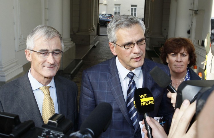Flemish Minister-President Kris Peeters (C) speaks to the press after a meeting concerning former Dexia Bank Group. The bank, which held massive Greek debt securities, had to be bailed out by the Belgian and French governments last week. (Bruno Fahy/AFP/Getty Images)