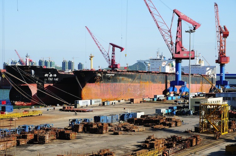 Cargo ships await loading in Qingdao Harbor, in northeast China's Shandong Province, Oct. 17. The U.S. trade deficit with China totaled $160 billion in the first half of 2011 alone. (STR/AFP/Getty Images) Cargo ships await loading in Qingdao Harbor, in northeast China's Shandong Province, Oct. 17. The U.S. trade deficit with China totaled $160 billion in the first half of 2011 alone. (STR/AFP/Getty Images)