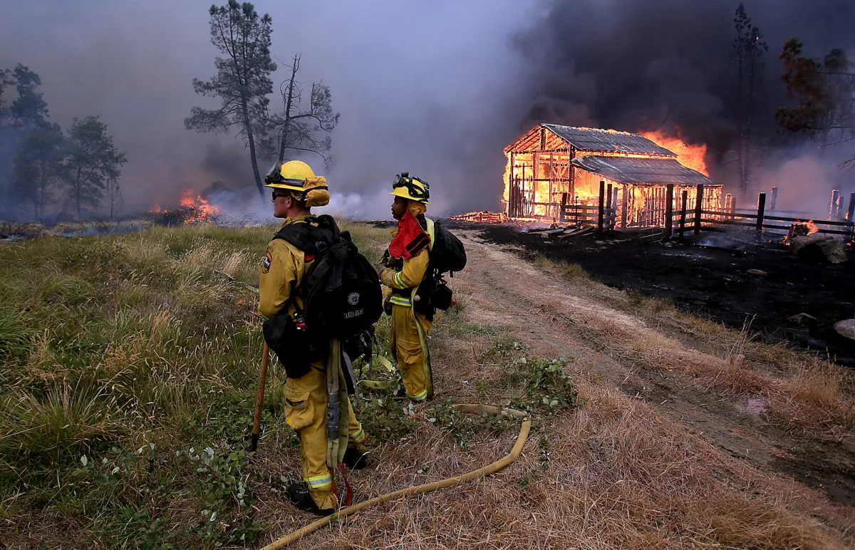 A barn burns in Whispering Pines on Cobb Mountain, Calif., Saturday, Sept. 12, 2015. (Kent Porter/The Press Democrat via AP)