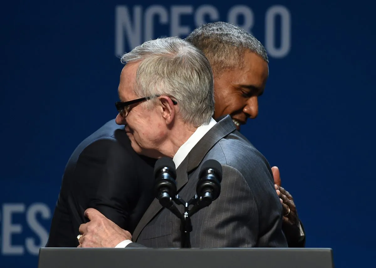 LAS VEGAS, NV - AUGUST 24: U.S. Senate Minority Leader Harry Reid (D-NV) (L) embraces U.S. President Barack Obama as Reid introduces him for a keynote address at the National Clean Energy Summit 8.0 at the Mandalay Bay Convention Center on August 24, 2015 in Las Vegas, Nevada. Political and economic leaders are attending the summit to discuss a domestic policy agenda to advance alternative energy for the country's future. (Photo by Ethan Miller/Getty Images)