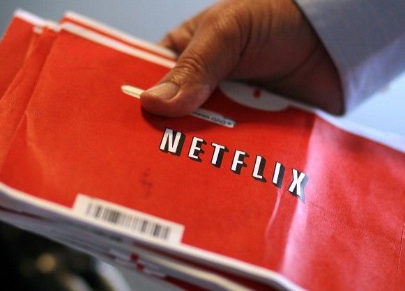 A U.S. Postal worker holds a stack of Netflix envelopes at a Post Office sort facility on October 24, 2011 in San Francisco, California. (Justin Sullivan/Getty Images) A U.S. Postal worker holds a stack of Netflix envelopes at a Post Office sort facility on October 24, 2011 in San Francisco, California. (Justin Sullivan/Getty Images)
