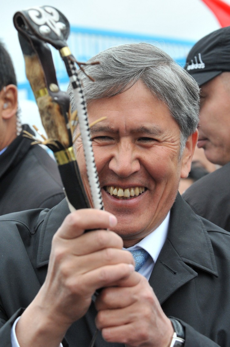 Kyrgyzstan's prime minister and presidential candidate Almazbek Atambayev smiles as he holds kamcha, a traditional riding whip and symbol of power, during his meeting with local residents in Akzhar, a district on the outskirts Bishkek, on Oct. 27. (Vyacheslav Oseledko/AFP/Getty Images ) Kyrgyzstan's prime minister and presidential candidate Almazbek Atambayev smiles as he holds kamcha, a traditional riding whip and symbol of power, during his meeting with local residents in Akzhar, a district on the outskirts Bishkek, on Oct. 27. (Vyacheslav Oseledko/AFP/Getty Images )