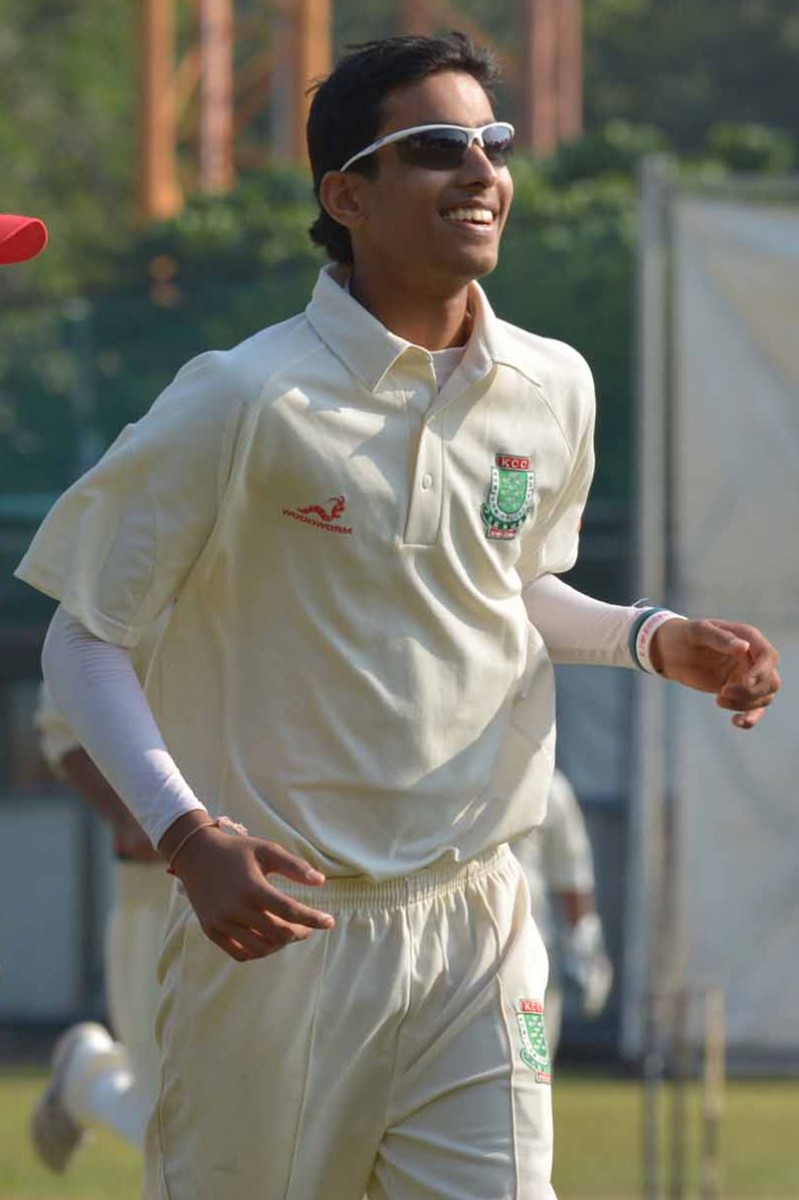Karan Shah celebrates taking his first wicket