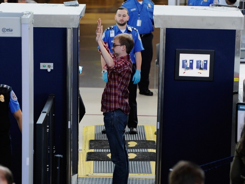 A traveler is screened by a body scanner at the security checkpoint in an airport. (Kevork Djansezian/Getty Images) A traveler is screened by a body scanner at the security checkpoint in an airport. (Kevork Djansezian/Getty Images)