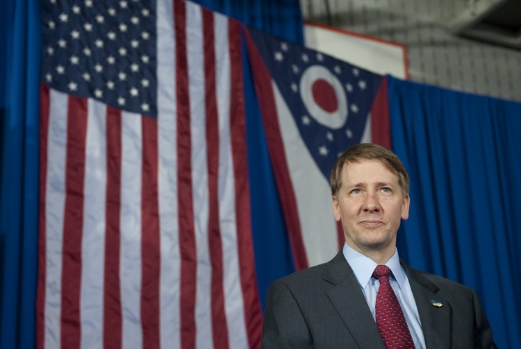 In this file photo, Richard Cordray, incoming head of the Consumer Financial Protection Bureau, stands offstage after President Barack Obama spoke in Shaker Heights, Ohio on Jan. 4 In this file photo, Richard Cordray, incoming head of the Consumer Financial Protection Bureau, stands offstage after President Barack Obama spoke in Shaker Heights, Ohio on Jan. 4
