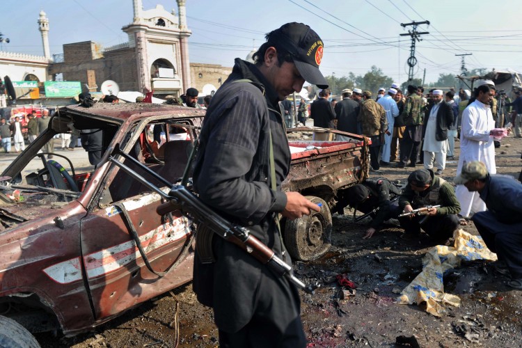 Pakistani security personnel examines th Epoch Times Photo