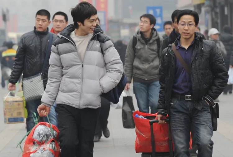 Migrant workers prepare to board trains back to their rural homes at the start of the Chinese New Year holiday, in Beijing on Jan. 17, 2012. (Mark Ralston/AFP/Getty Images)