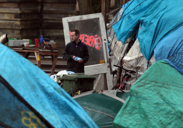 Protestors From Occupy Bristol Face Eviction A lone protester looks out from a structure in the remains of the Occupy Bristol camp on College Green on January 24, 2012 in Bristol, England. The remaining anti-capitalist demonstrators still at the camp - which became the largest tented demonstration outside London and was set up in solidarity with the international Occupy movement - have been served with an eviction notice and have been told they will be forcibly removed if they do not leave of their own accord. (Photo by Matt Cardy/Getty Images)