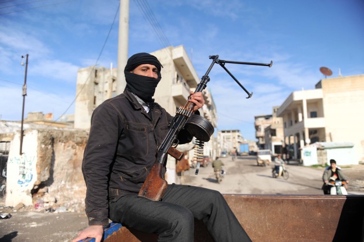 A member of the Free Syrian Army sits in Epoch Times Photo