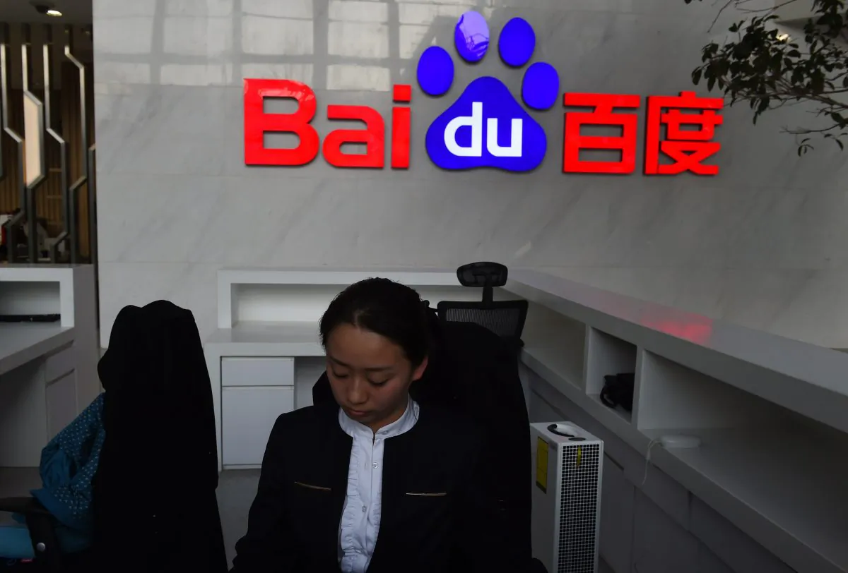 A receptionist works in the still-under-construction Baidu research and development center in Beijing on December 17, 2014. (Greg Baker/AFP/Getty Images)