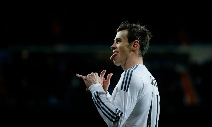 Gareth Bale of Real Madrid CF shows his tounge celebrating scoring their opening goal during the La Liga match between Real Madrid CF and Villarreal CF at Estadio Santiago Bernabeu on February 8, 2014 in Madrid, Spain. (Photo by Gonzalo Arroyo Moreno/Getty Images)