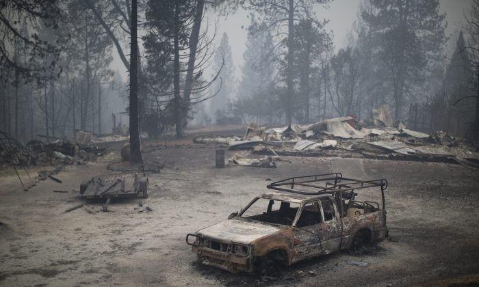 SAN ANDREAS, CA - SEPTEMBER 13:  A burned truck and structures are seen at the Butte Fire on September 13, 2015 near San Andreas, California. California governor Jerry Brown has declared a state of emergency in Amador and Calaveras counties where the 100-square-mile wildfire has burned scores of structures so far and is threatening 6,400 in the historic Gold Country of the Sierra Nevada foothills.  (Photo by David McNew/Getty Images)