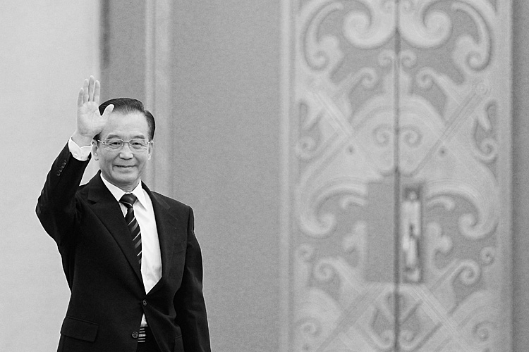 Wen Jiabao, China's premier, waves as he arrives for a news conference Wen Jiabao, China's premier, waves as he arrives for a news conference