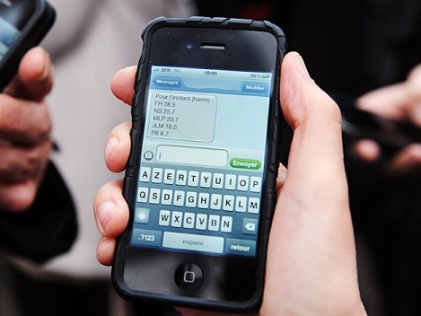 People receive sms on their mobile phone People receive sms on their mobile phone