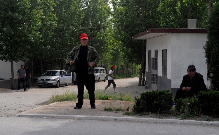 Plainclothes security monitor the entran Epoch Times Photo