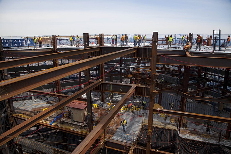 One World Trade Center Becomes Tallest Building In New York Ironworkers weld steel decking at the top of One World Trade Center