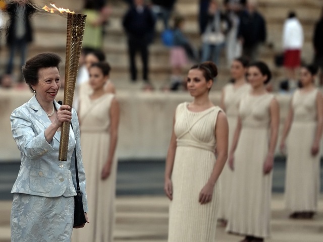 144678190 Princess Anne of Britain holds the Olympic torch